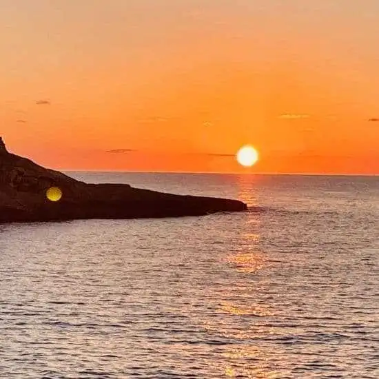 xwejni bay sunset