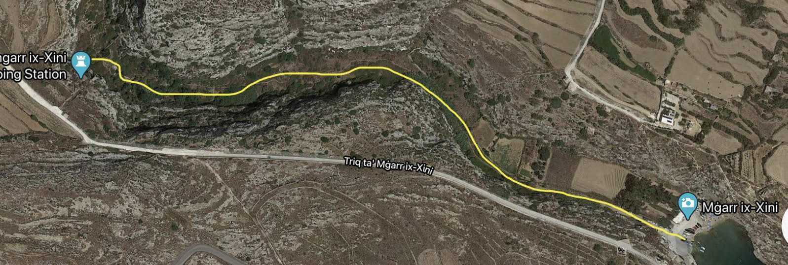 A map highlighting the scenic hiking trail route through the lush valley of Mgarr ix-Xini in Gozo, passing the historic pumping station.