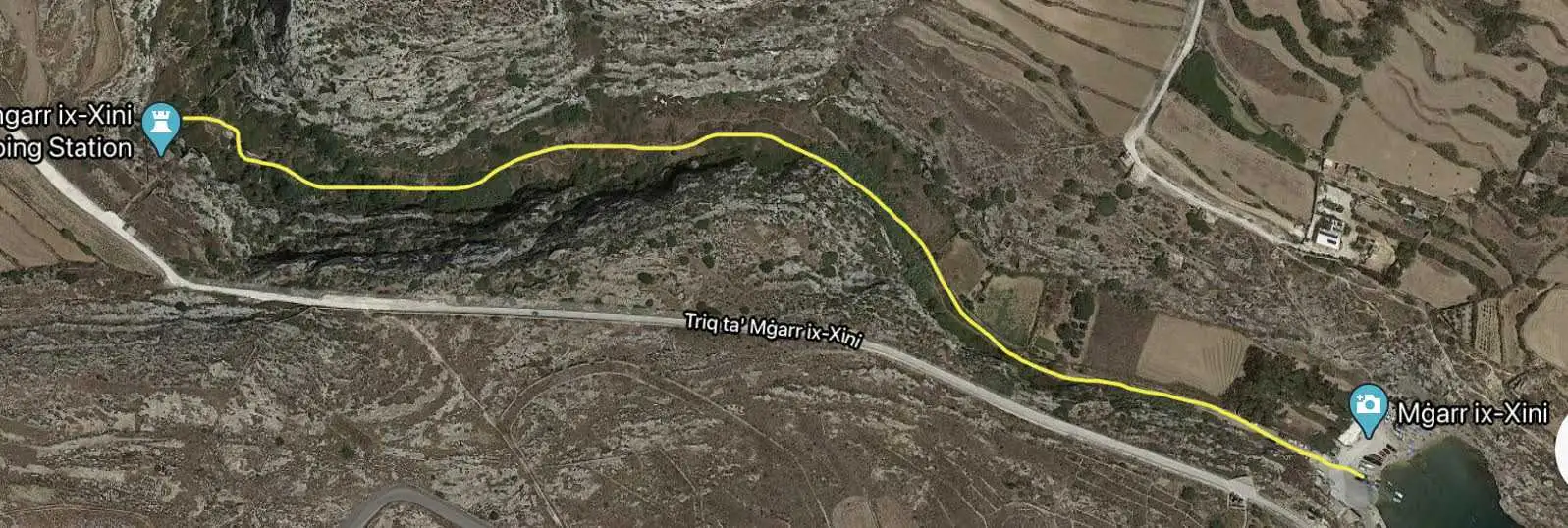 A map highlighting the scenic hiking trail route through the lush valley of Mgarr ix-Xini in Gozo, passing the historic pumping station.